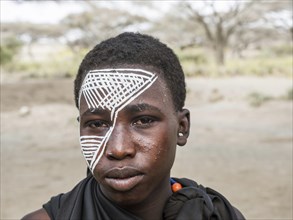 Young Massai warrior with face painting