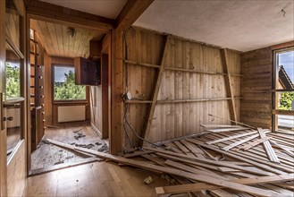 A room paneled with wood in a house that will be demolished