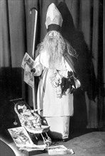 Santa Claus with doll carriage ca. 1930