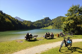 Cyclists take a break at the Alatsee