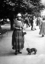 Woman walking her dachshund