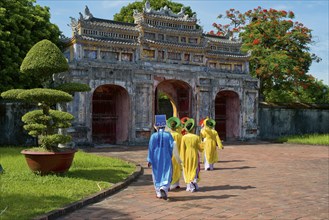Vietnamese extras walk through West Gate