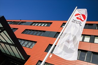 Flag in front of the new building of the Employment Agency