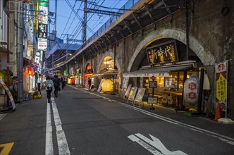 Restaurants under drawbridge at dusk