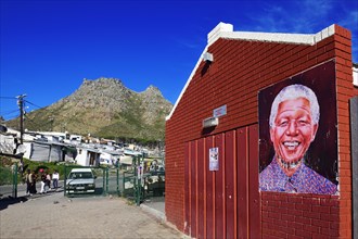 Nelson Mandela portrait on a wall of Imizamo Yethu township