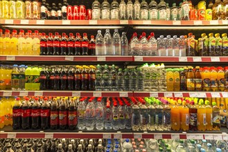 Cooling rack with beverage bottles in a motorway service area