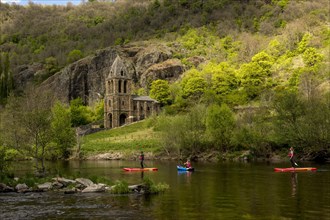 Notre Dame des Chazes church on the River Allier with canoeists