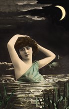 Woman bathing in the lake at night