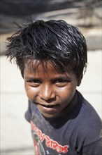Child in a slum at the Ghazipur garbage dump