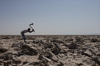 Worker in the salt desert in Dallol