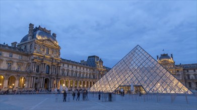 Louvre with glass pyramid at dusk