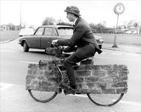 Man on a strange bicycle