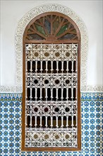 Ornate window surrounded by colorful wall tiles at the Heritage Museum