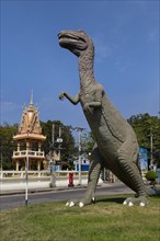 Dinosaur figure at the entrance of the village