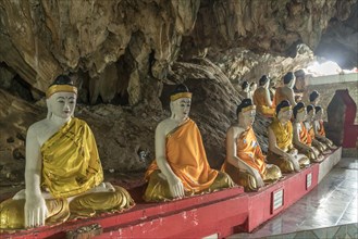 Sitting Buddha statues in the Bayin Nyi Cave Temple