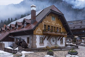 Old Black Forest house with fan painting and large wall clock