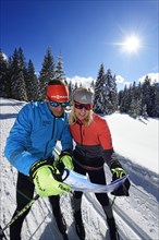 Olympic silver medal winner Tobi Angerer with his wife Romy on the cross-country trail of the Winklmoos-Alm