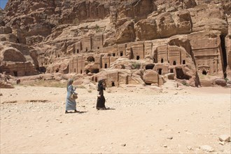 Bedouins in front of stone tombs
