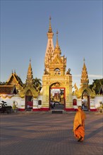 Monk in front of Chedi of Wat Phra That Phanom