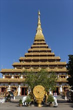 Wheel of Life in front of a nine-story Stupa Phra Mahathat Kaen Kakhon