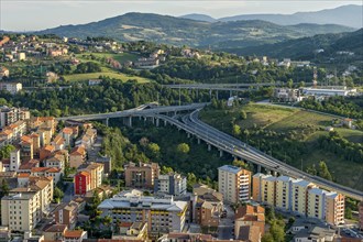 View from Castello Monforte over apartment blocks and motorway junction