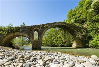 Old Ottoman stone arch bridge Ura e Golikut over river Shkumbin