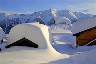 Snow-covered Maria zum Schnee chapel in the village centre