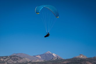 Paraglider over volcanic landscape in front of the Teide