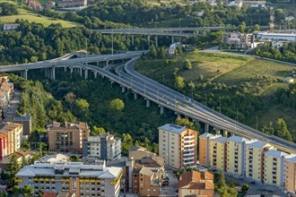 View from Castello Monforte over apartment blocks and motorway junction