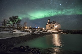 Northern lights over church of Gimsoy
