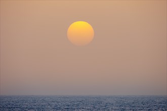 Sunset by sea fog