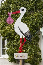 Stork figure as birth symbol