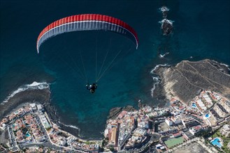 Paraglider over the Atlantic Ocean near La Caleta