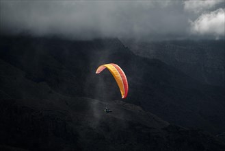 Paragliding over volcanic landscape
