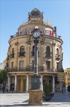 Round building El Gallo Azul with clock
