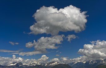 Cumulus clouds over mountain range