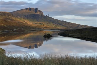 Rock formation of the Old Man of Storr with Loch Leathan