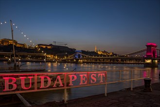 Illuminated Budapest sign with Danube and Chain Bridge