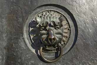 Lion's head as door knocker at the entrance portal of the Lorenzkirche