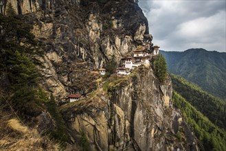 Buddhist tiger nest monastery Taktshang on steep rock face