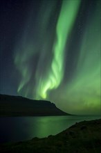 Northern lights at new moon over fjord