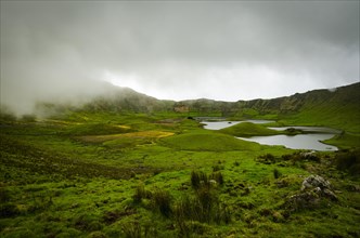 Crater of Caldeirao Volcano im mist