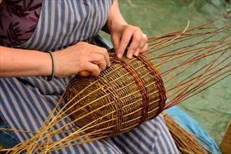 Woman at making a basket