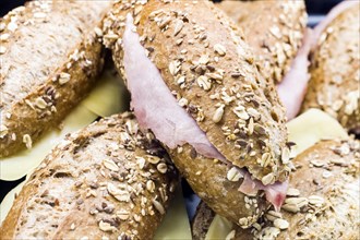 Whole grain rolls with grains with cheese and ham