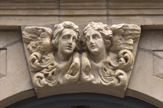 Relief of two angel heads