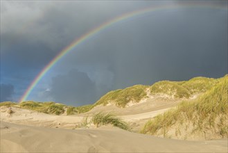 Rainbow over dune landscape