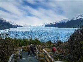 Tourists on a viewing platform at the Perito Moreno glacier