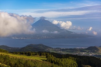 View of volcano Ponta do Pico with clouds
