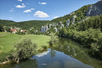 Jurassic limestone rocks are reflected in the Danube