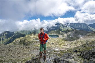 Hiker on the summit of the Greifenberg